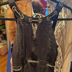 Thalia Sodi black maxi dress with gold accents.